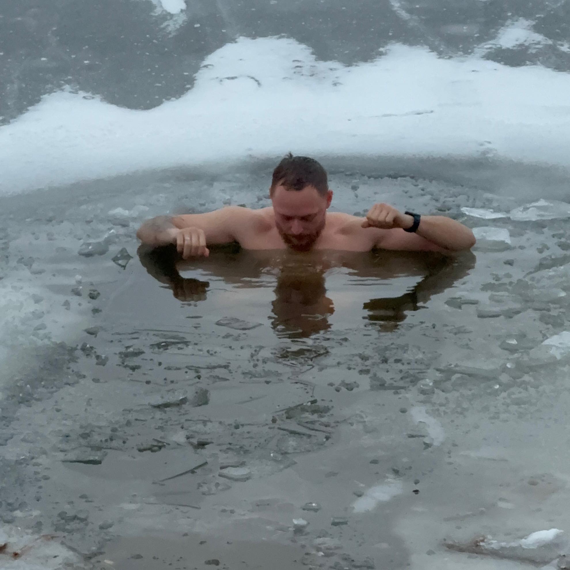 Dominykas cold plunging in ice